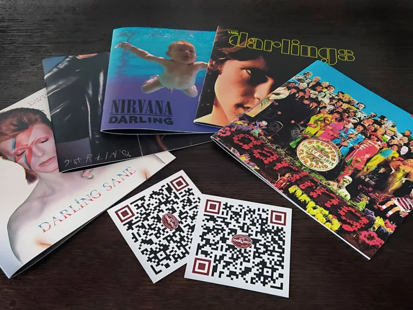 Darling Bar themed menus with covers inspired by well-known albums, with QR cards