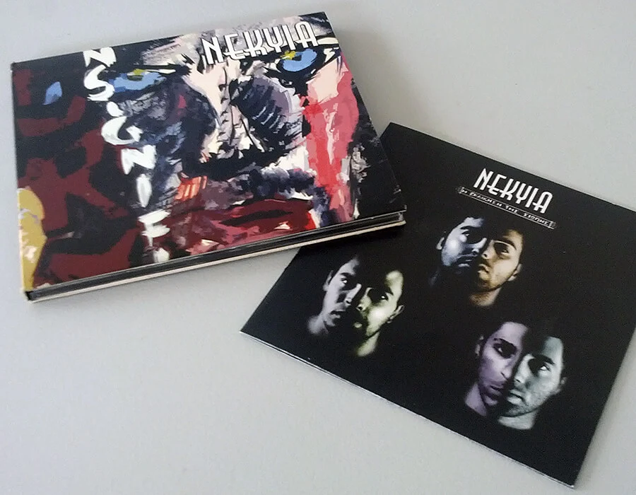 The NEKYIA CD cover with a painted face, next to the black-and-white back cover with the band members