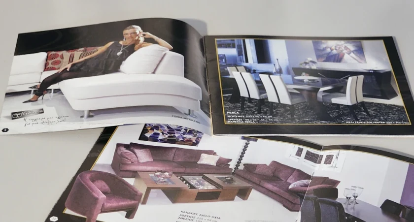 Open pages of the Tiniakos furniture catalogue with living rooms and dining sets