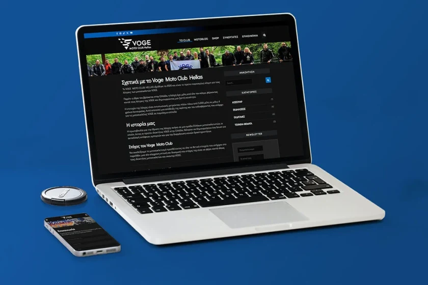 Η σελίδα «Σχετικά με το Voge Moto Club Hellas» σε laptop, με ομαδική φωτογραφία μελών της λέσχης
